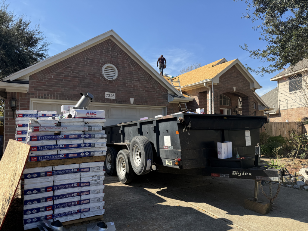 Materials and dumpster in the driveway